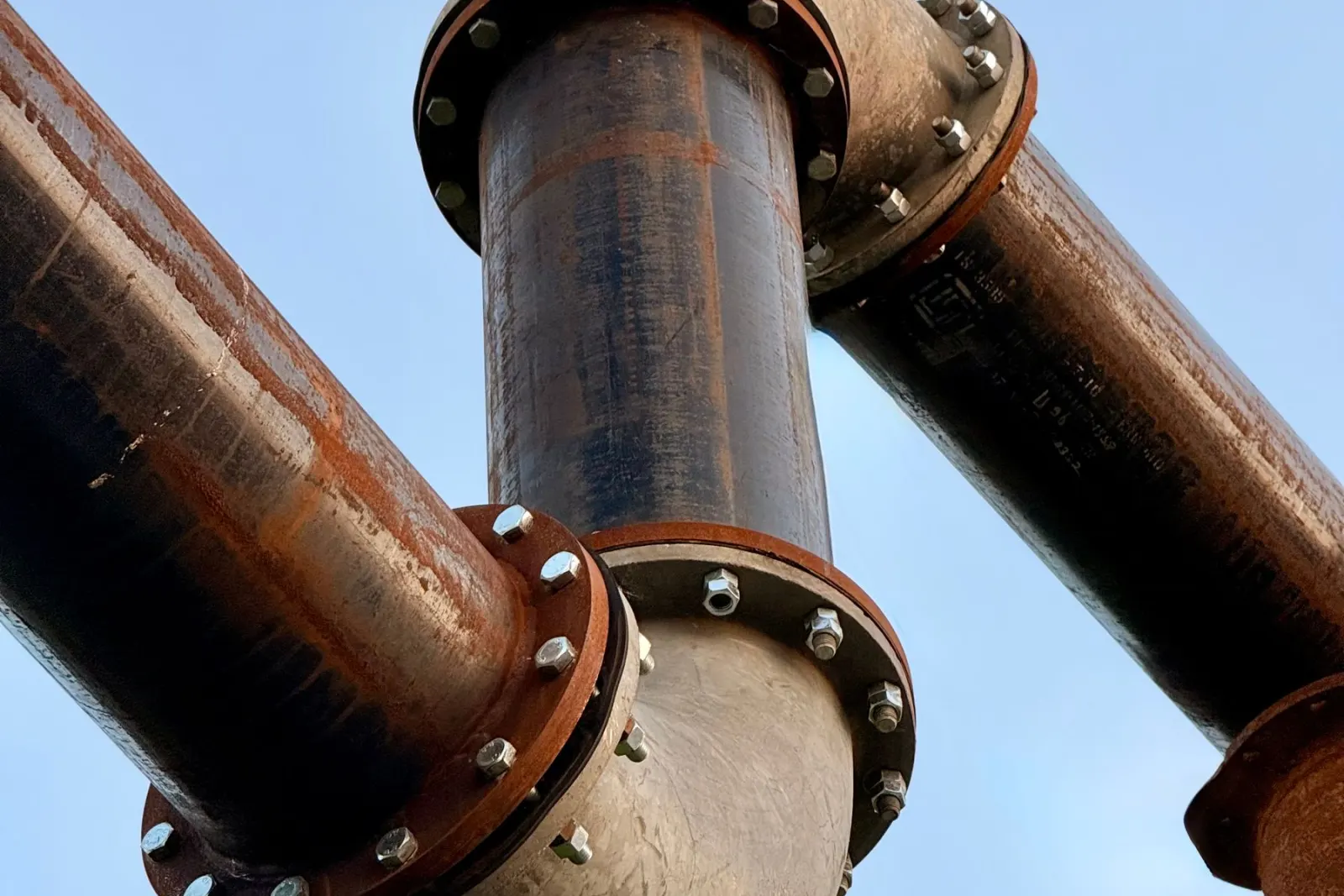 A wrench on a copper pipe joint being remade